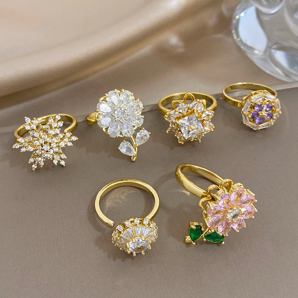 Gold-plated snowflake flower ring set with clear zirconia stones on multiple bands