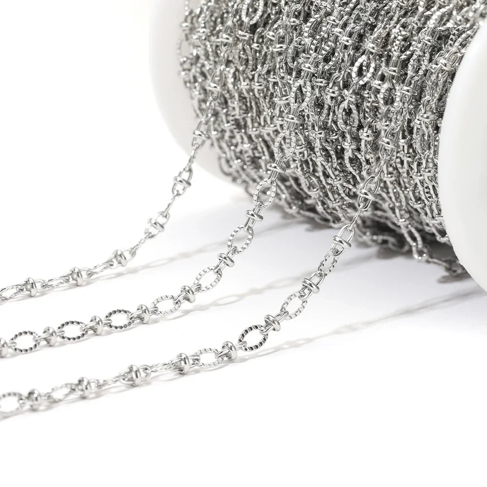 Silver embossed oval link chain with small round oval links for necklace or bracelet