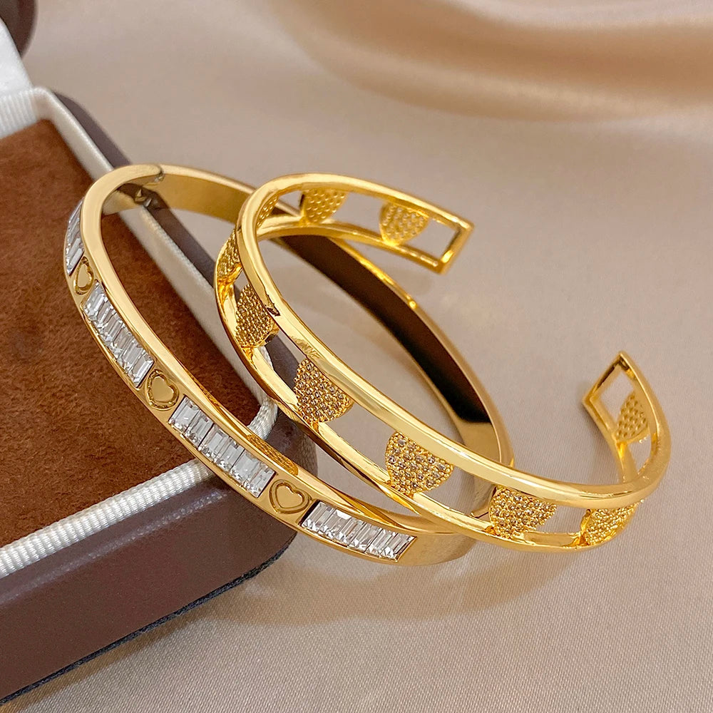 Gold and clear stone heart cuff bangle set, overlapping hinged bracelets