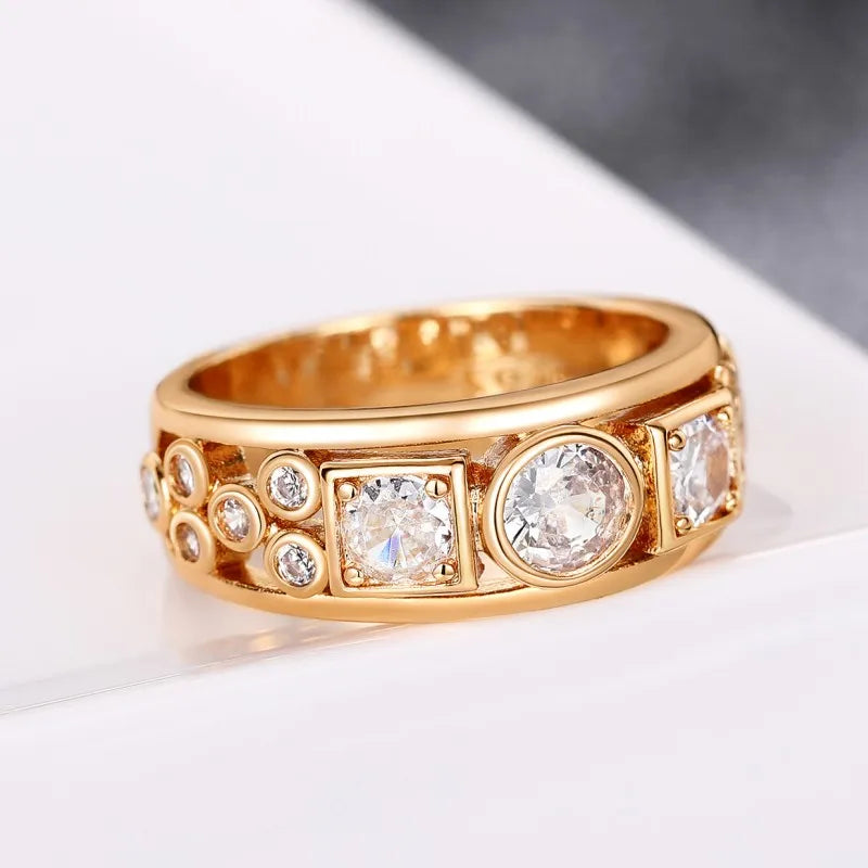 Gold-tone geometric CZ ring with rectangular panel and round side stones