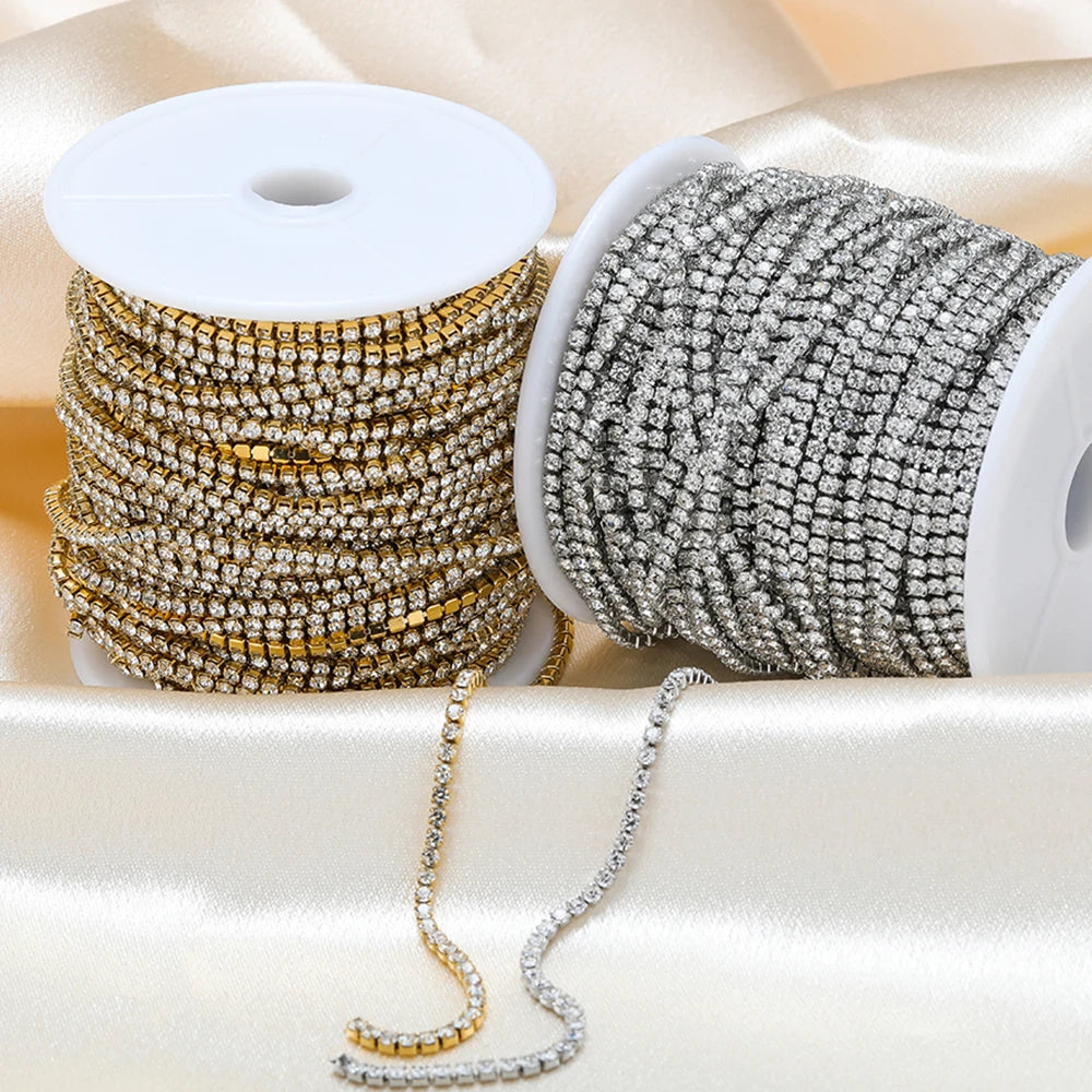 Cubic zircon chain on white spools, gold and silver-toned sparkling strands for DIY