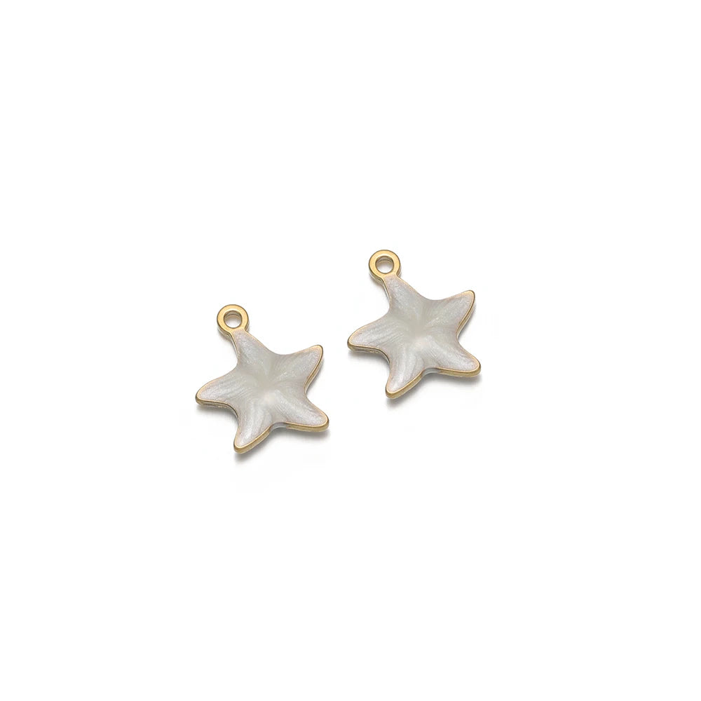 White enamel star charms with gold-tone loops, two-piece set
