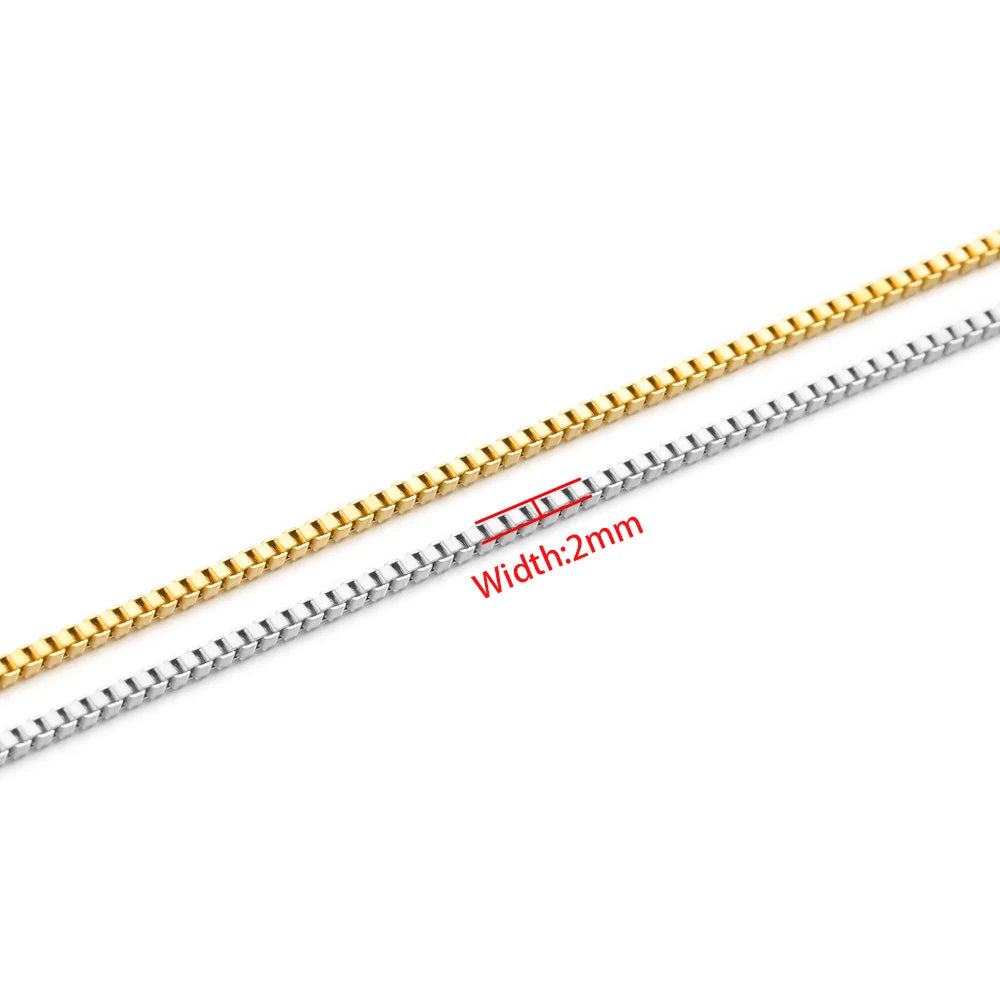 Gold and steel box chain strands, 2mm width, laid out for necklace and bracelet making