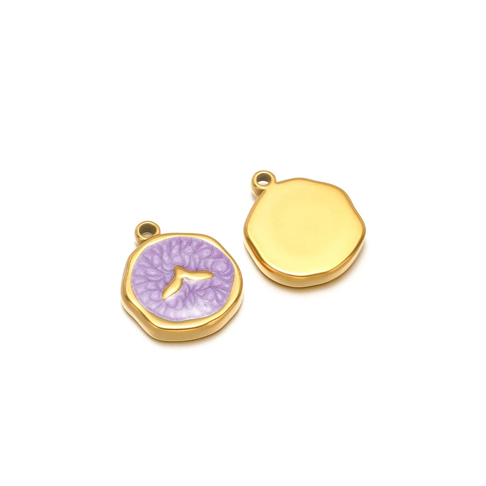 Pair of enamel ocean charms: yellow shell charm and purple seashell charm with gold fish