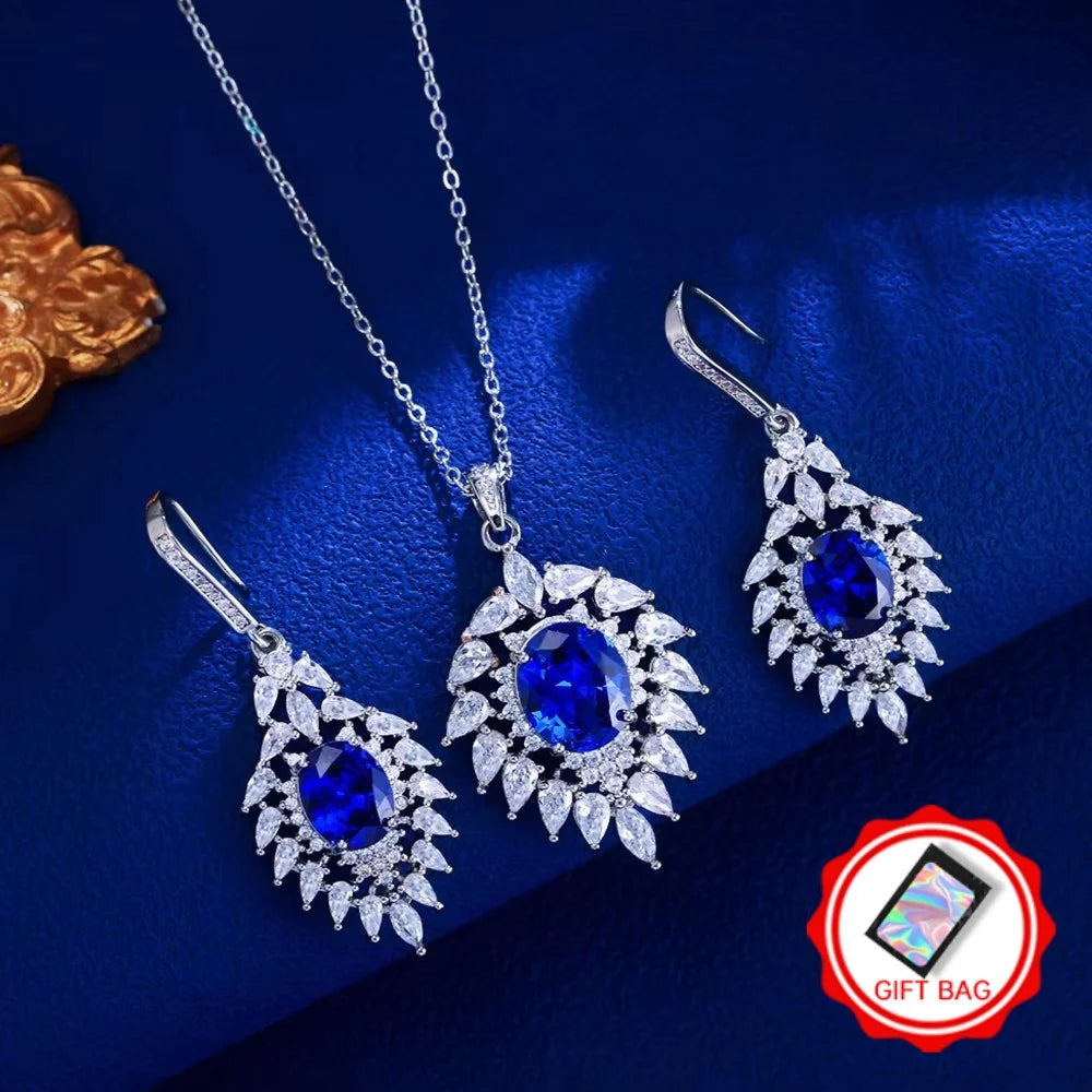 Blue oval CZ necklace and marquise halo earrings with gift bag