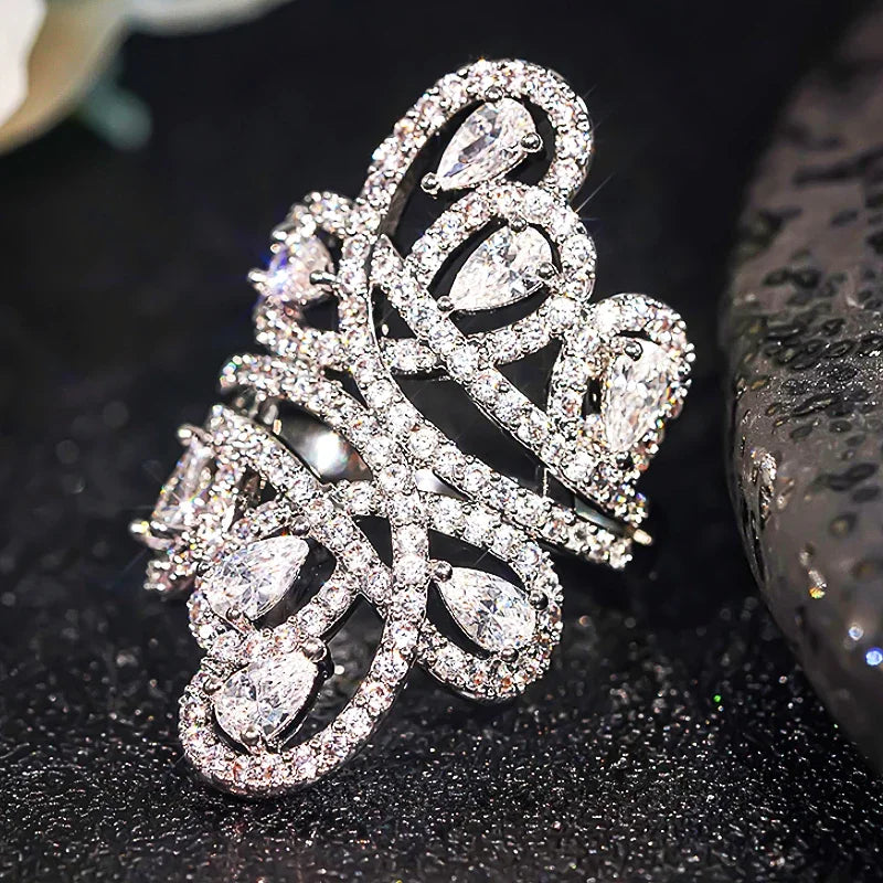 CZ ring with sparkling hollow filigree and teardrop stones