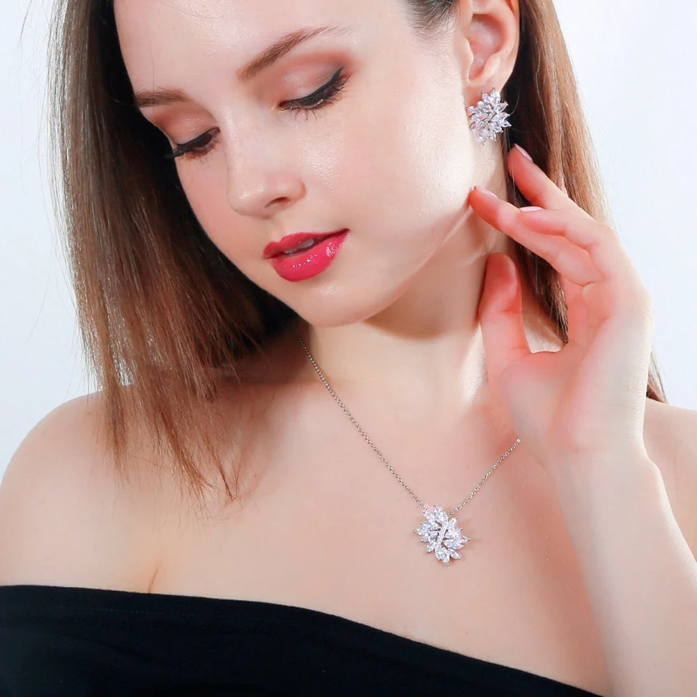 Marquise-cut zirconia leaf necklace and earring modeled on a person
