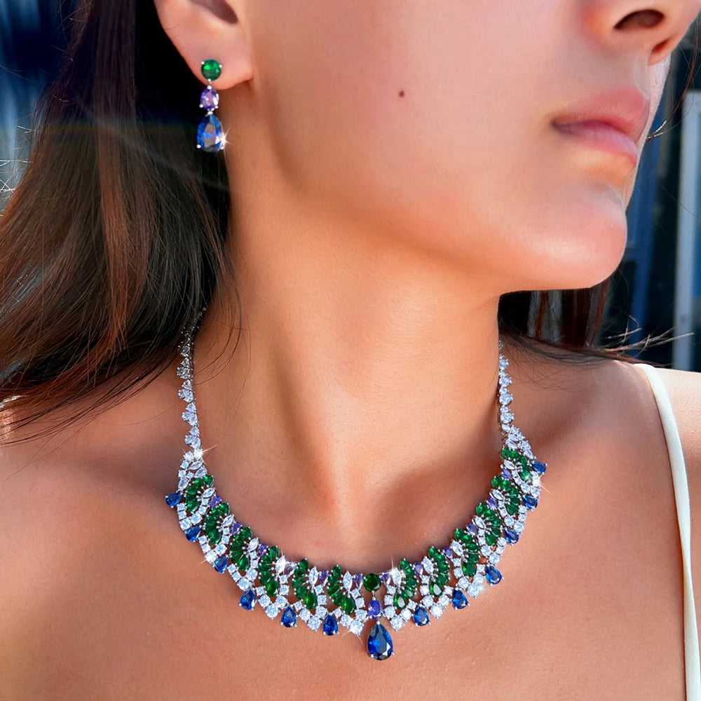 Multicolor teardrop zircon necklace and matching earring, shown worn close up