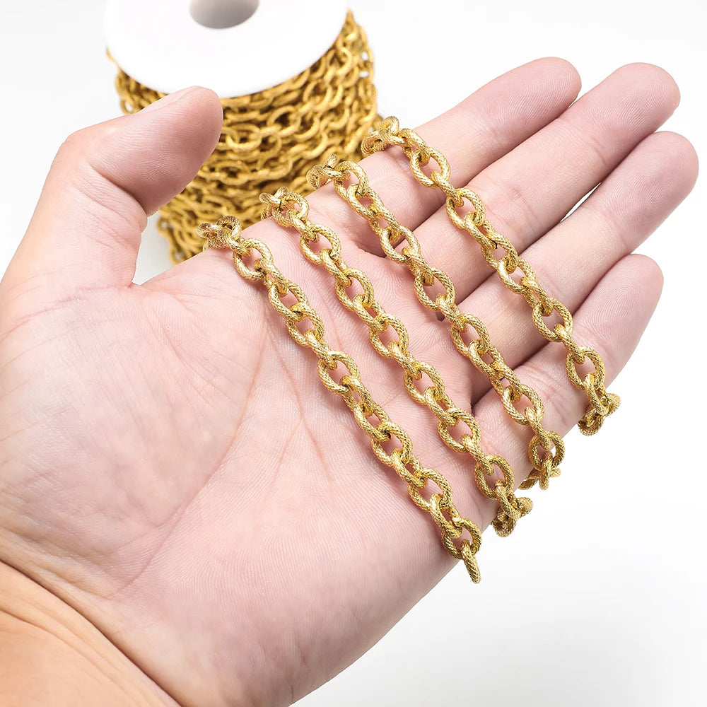 Gold chunky chain links held in hand, textured oval links for DIY choker