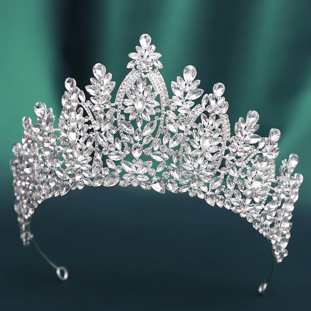 Silver crystal tiara with large oval stones and ornate floral crown design