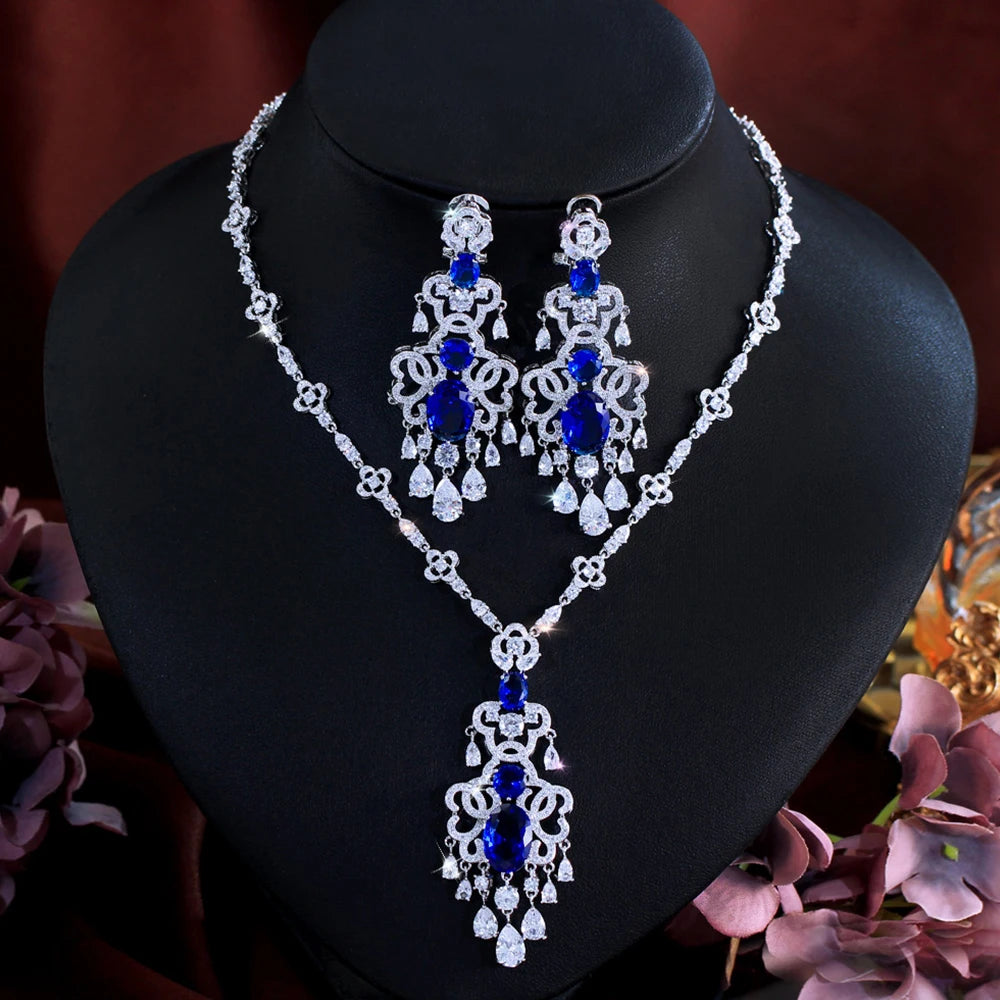 Silver-tone royal blue crystal pendant necklace with matching chandelier drop earrings