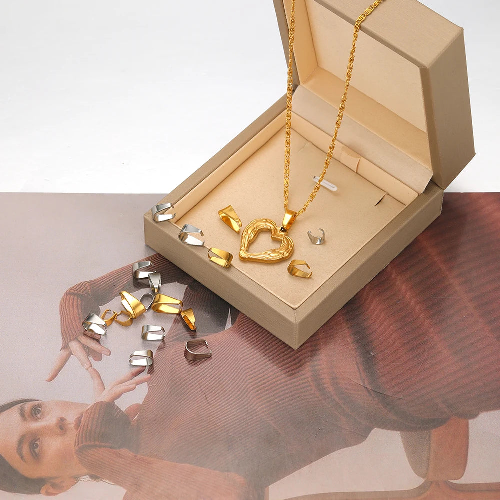 Gold-tone heart pendant necklace with chain and clip clasp connectors in open box