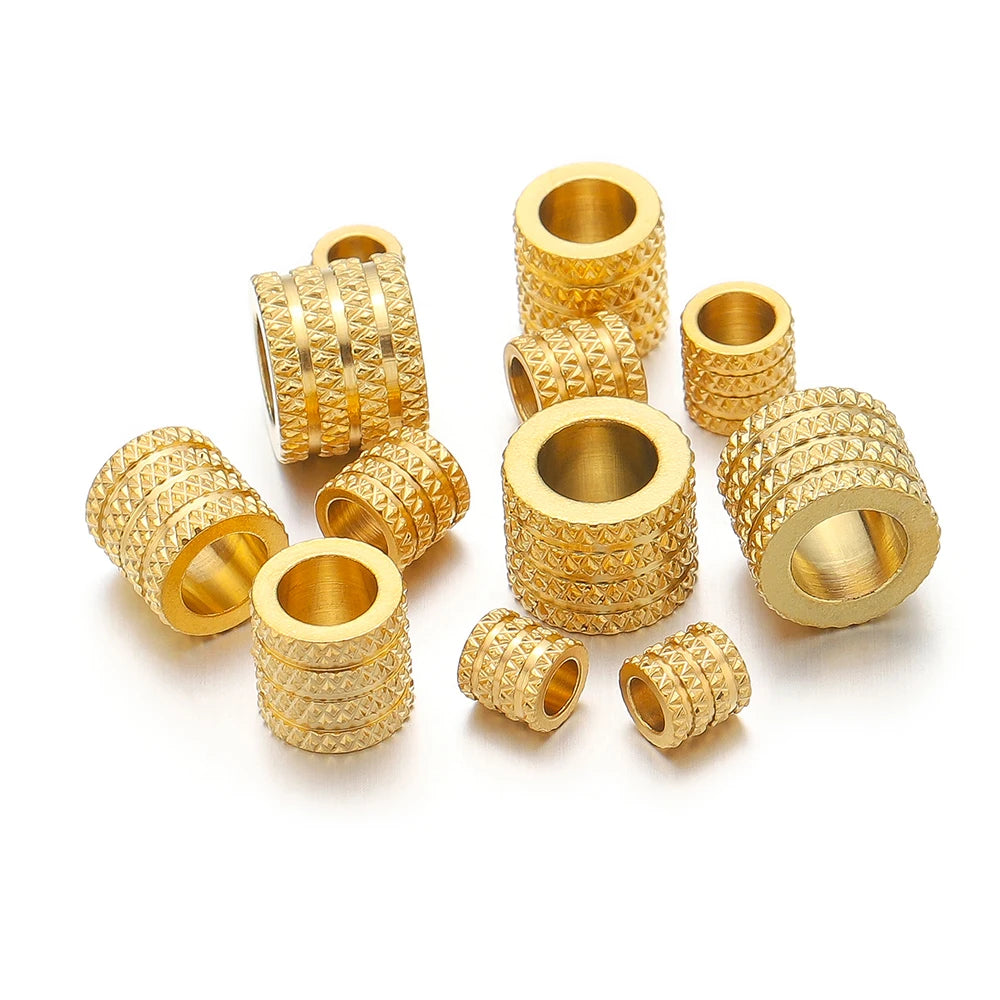 Gold-tone large-hole spacer beads with textured diamond pattern and open center holes