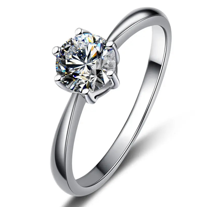 Silver-tone six-prong round cubic zirconia wedding ring with clustered side prongs
