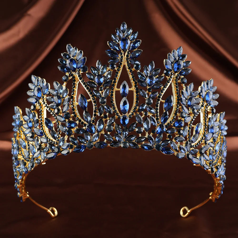 Blue rhinestone tiara with ornate leaf-like crown design and openwork setting