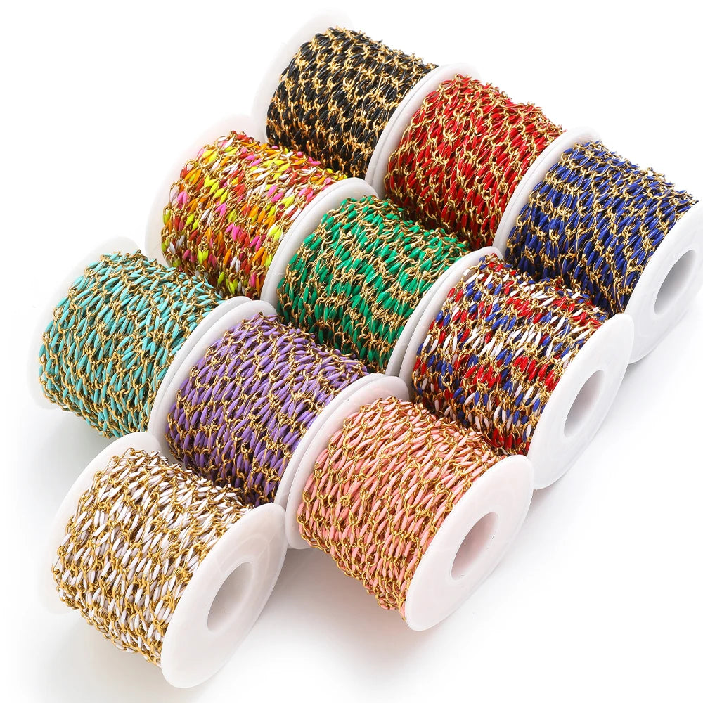 Twisted enamel chain set on spools with mixed gold, purple, teal, red, and green