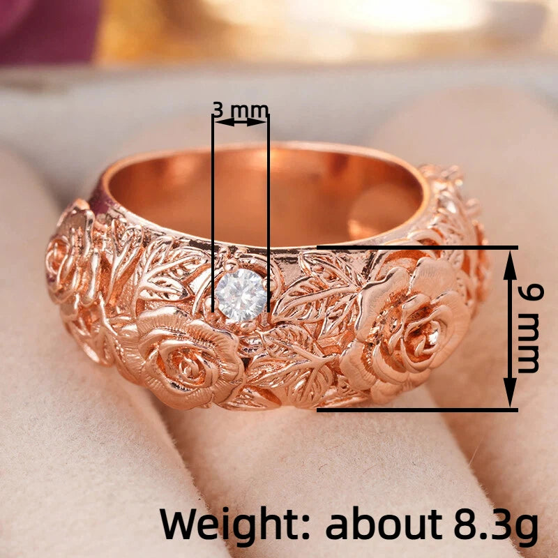 Rose gold floral CZ ring with rose details and round center stone, sculpted band