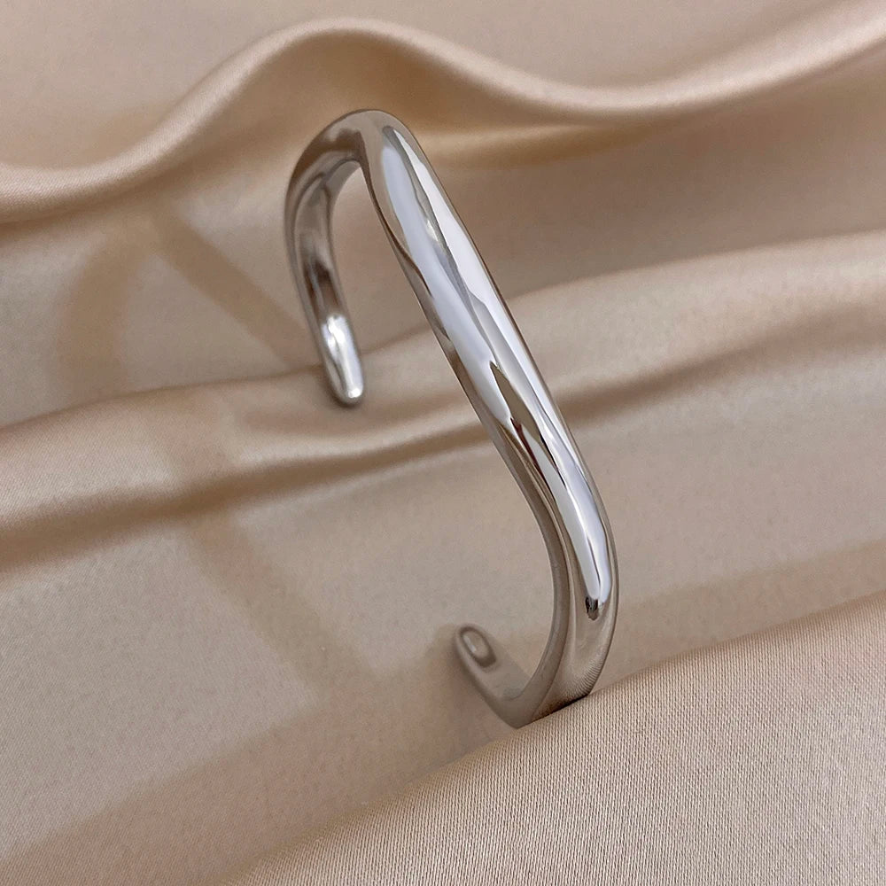 Polished silver cuff bracelet with smooth oval profile
