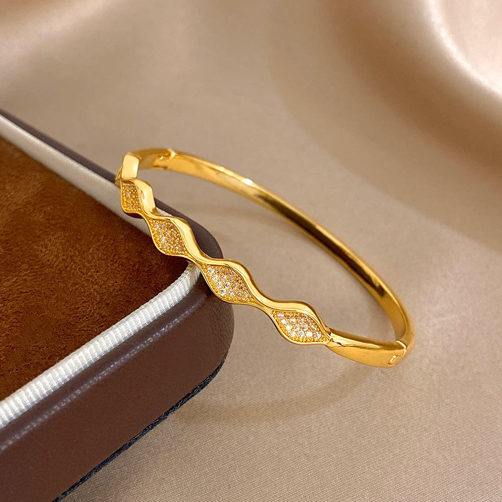Gold-plated geometric wave cuff bangle bracelet with faceted stone segments