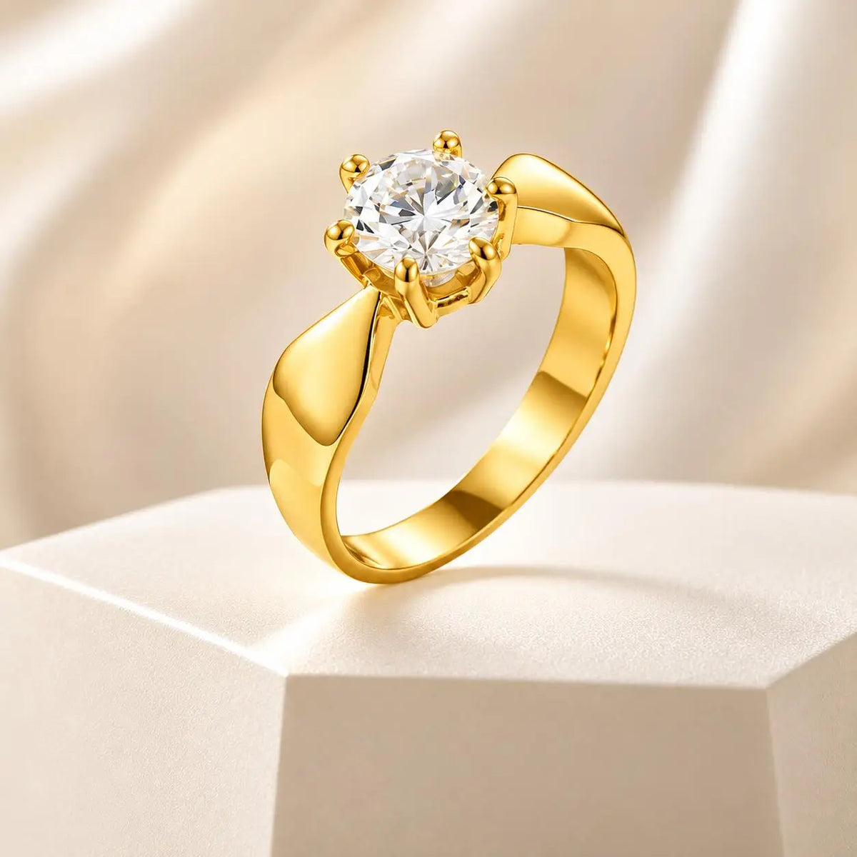 Shimmering gold-tone ring with round cubic zirconia in four-prong heart setting