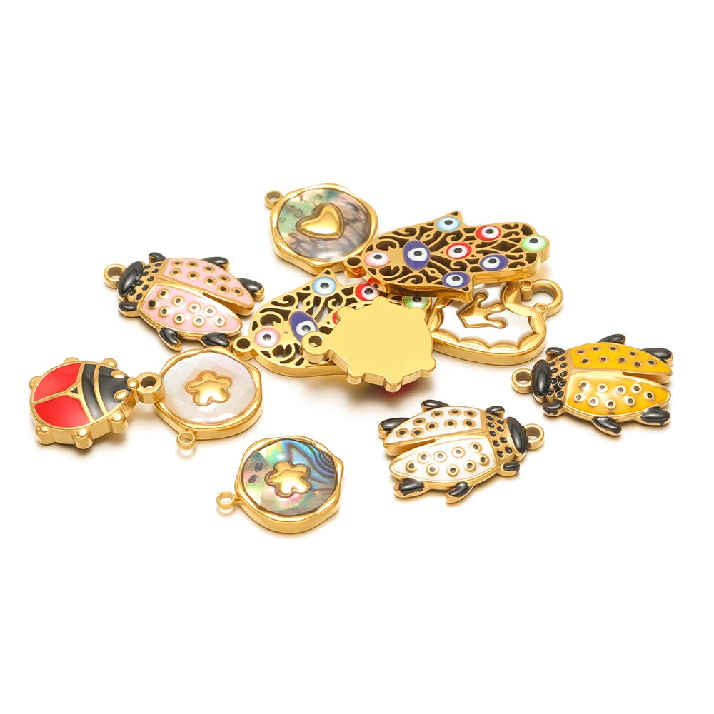 Assorted beetle shell charm pendants with multicolor enamel and gold-tone edges.