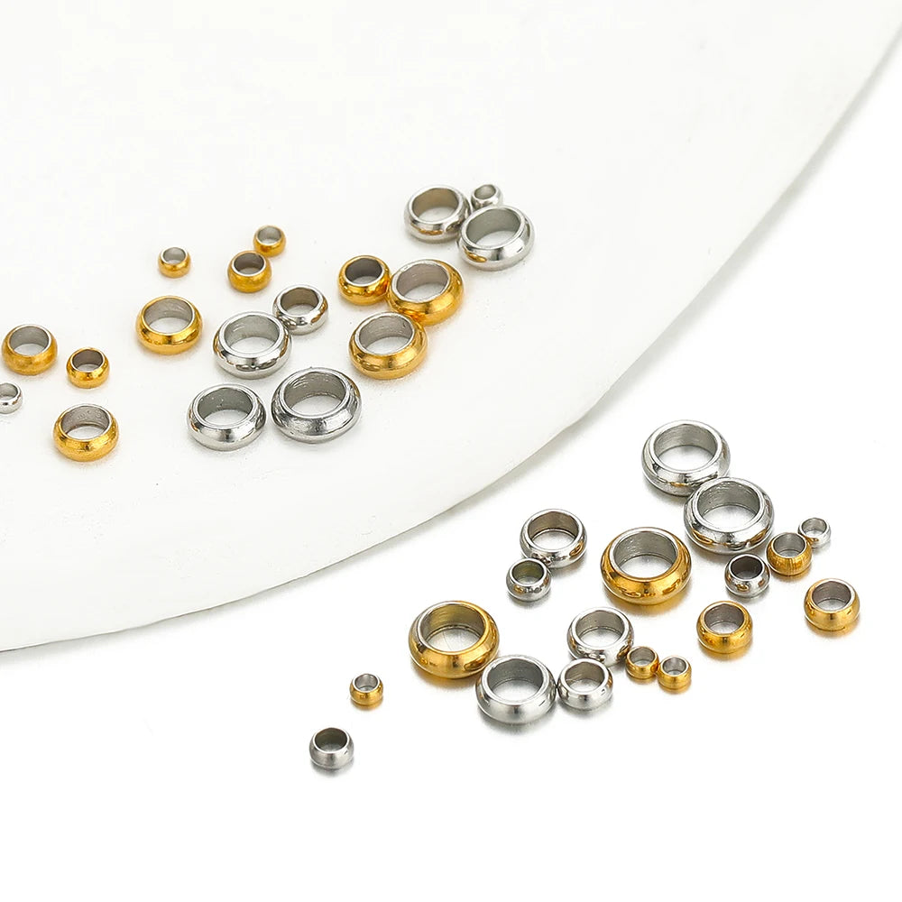 Gold and silver crimp end spacer bead stoppers, assorted sizes in a group