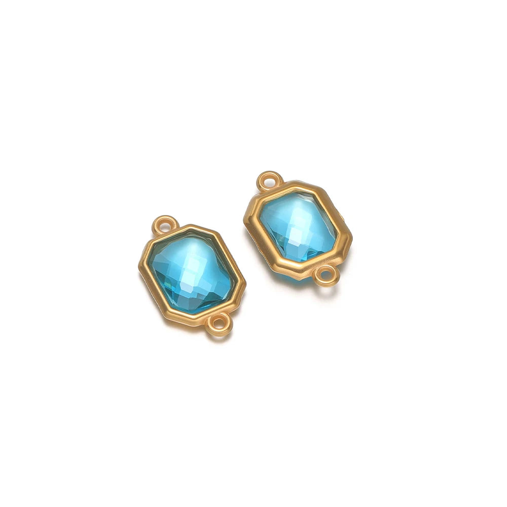 Light blue faceted glass octagon charm connector with gold-tone loop, stainless steel