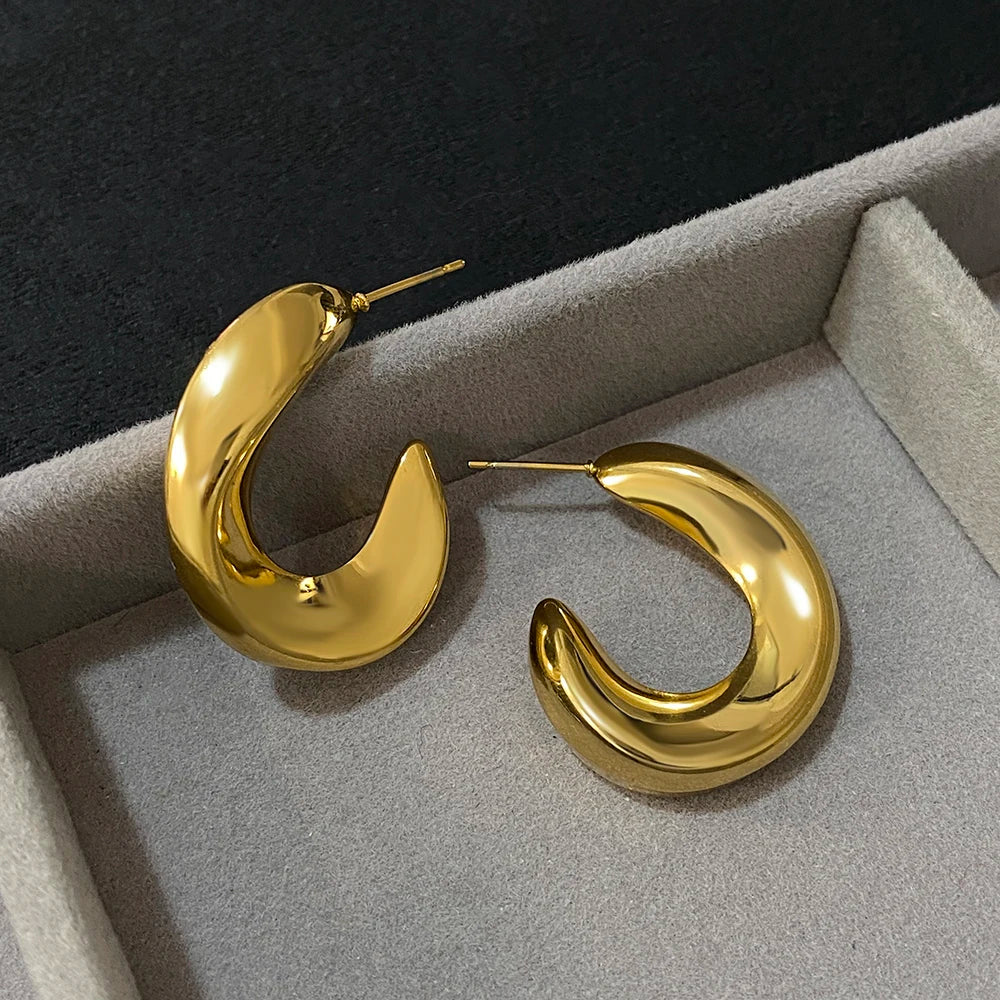 Pair of gold-tone glossy crescent hoop earrings with post backs