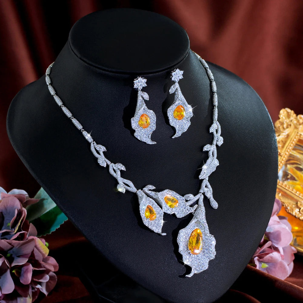 Calla lily necklace and earrings set displayed at an angle, with yellow center stones