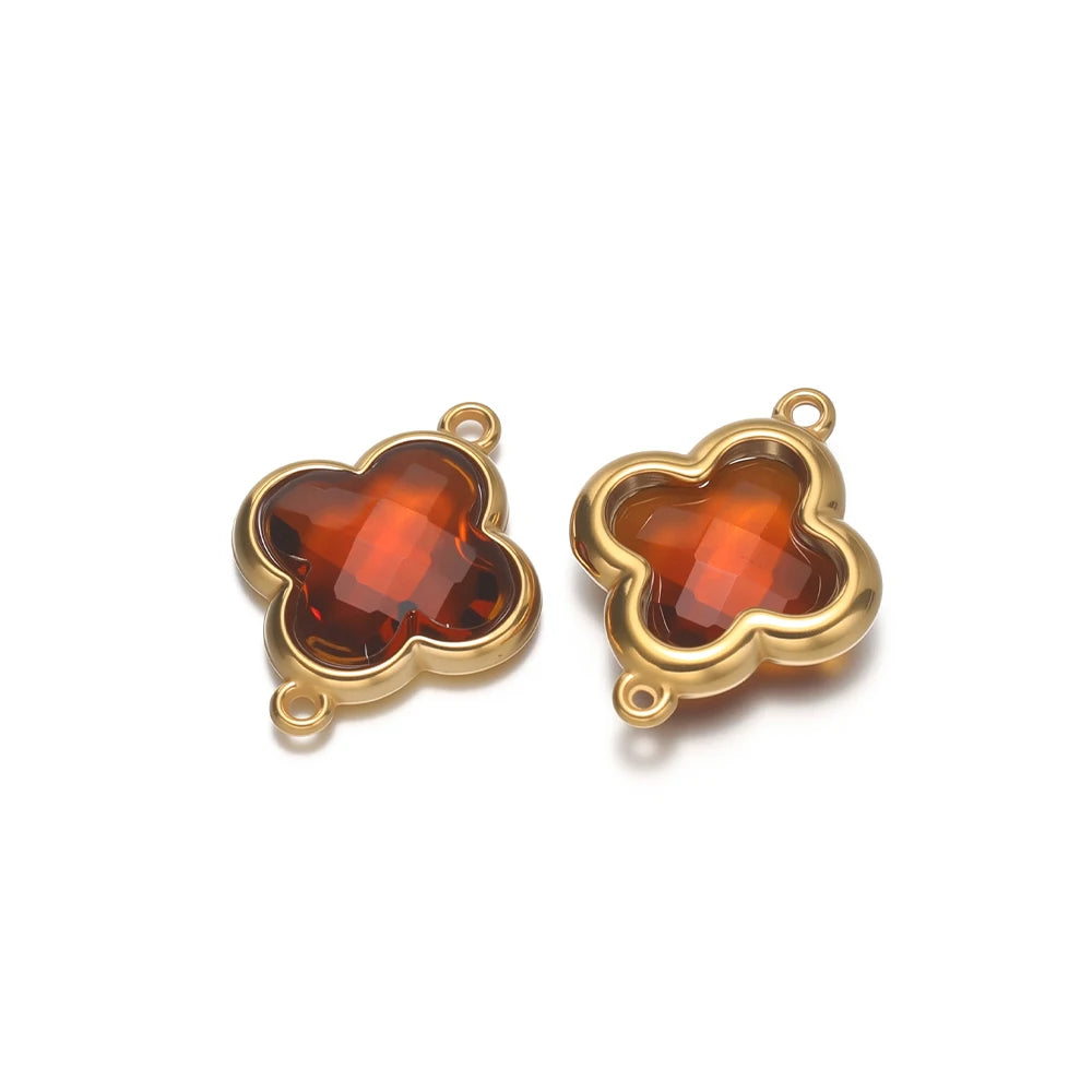 Clover glass pendant charm, orange-brown stone with gold-tone frame and loops