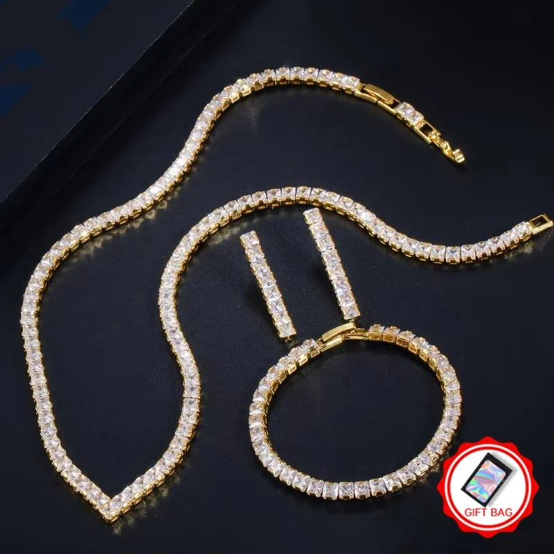 Gold-tone cubic zirconia jewelry set with tennis necklace, bracelet and drop earrings