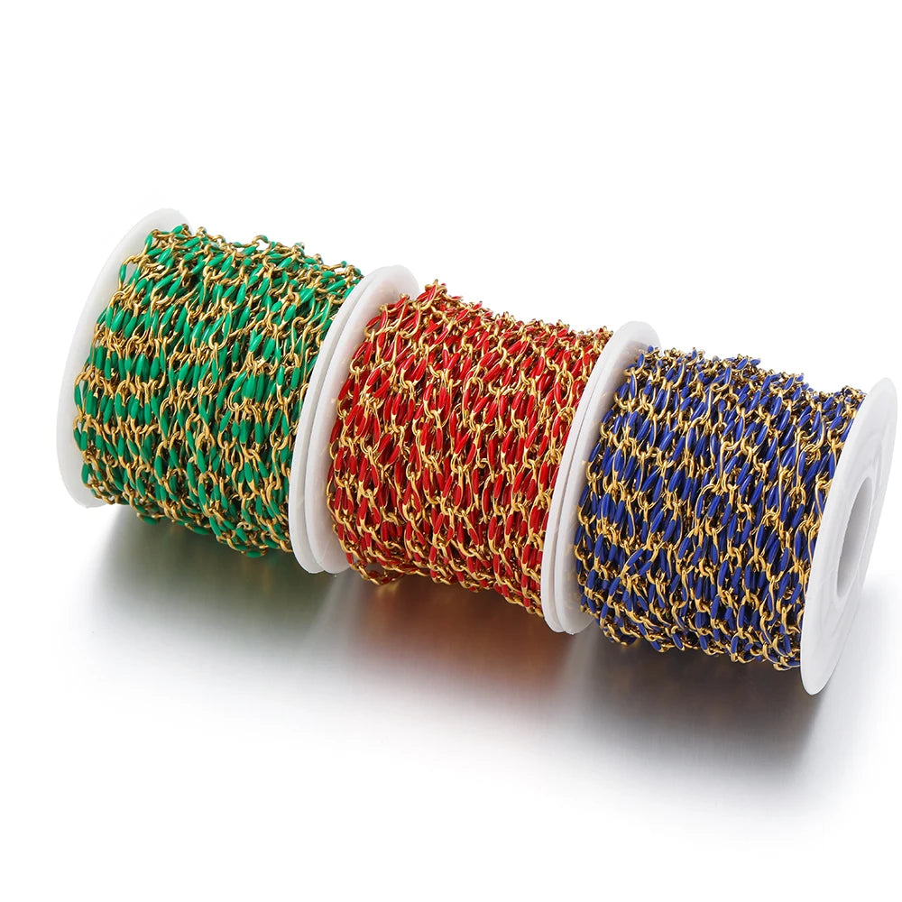 Twisted enamel chain on three spools: teal, red, and royal blue twisted links