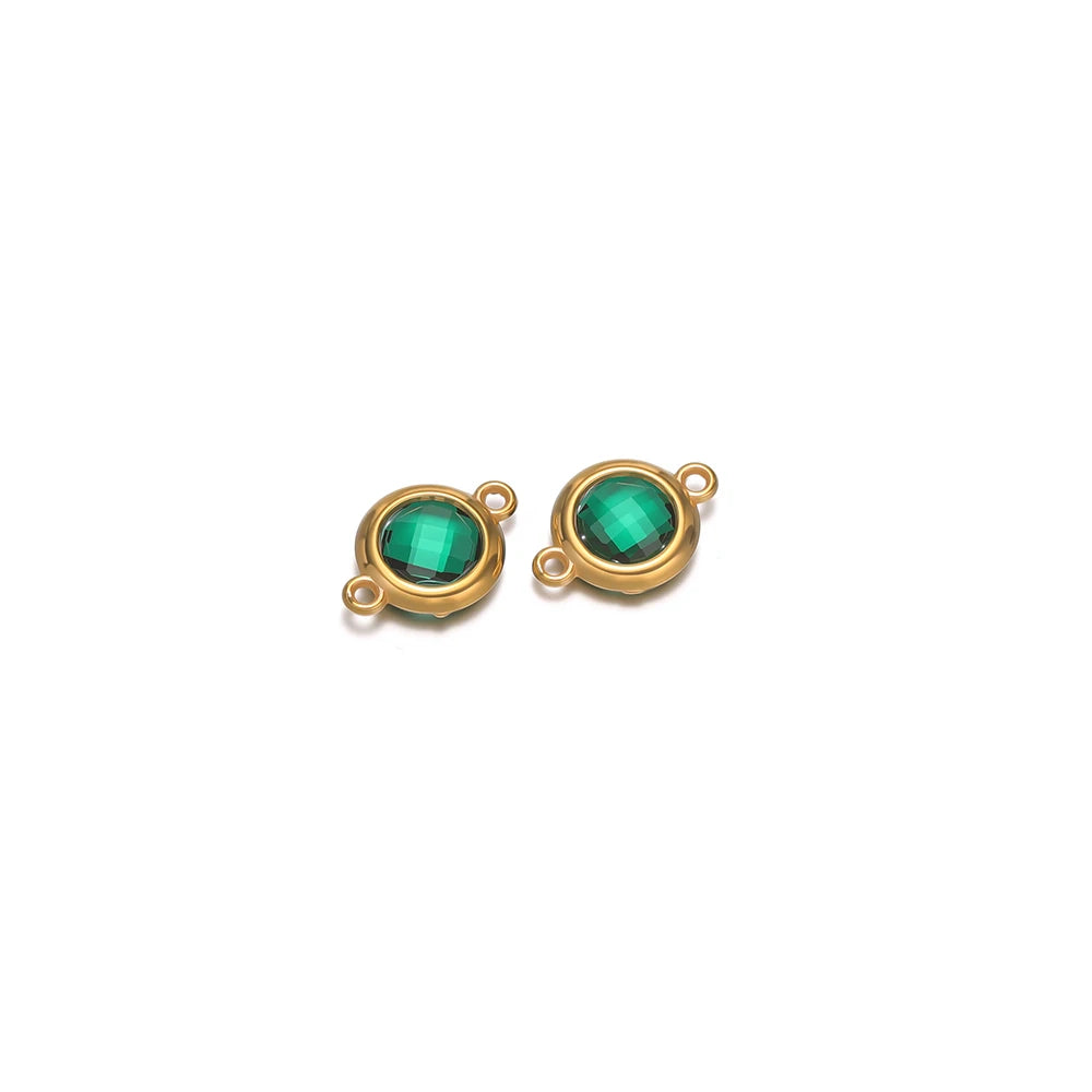 Round green faceted glass charm pendants with gold-tone frames and loop hooks