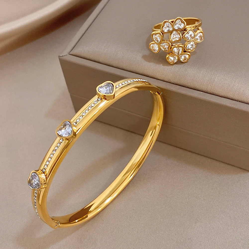 Gold-tone heart-stone bangle bracelet with flower cluster ring and clear round gems