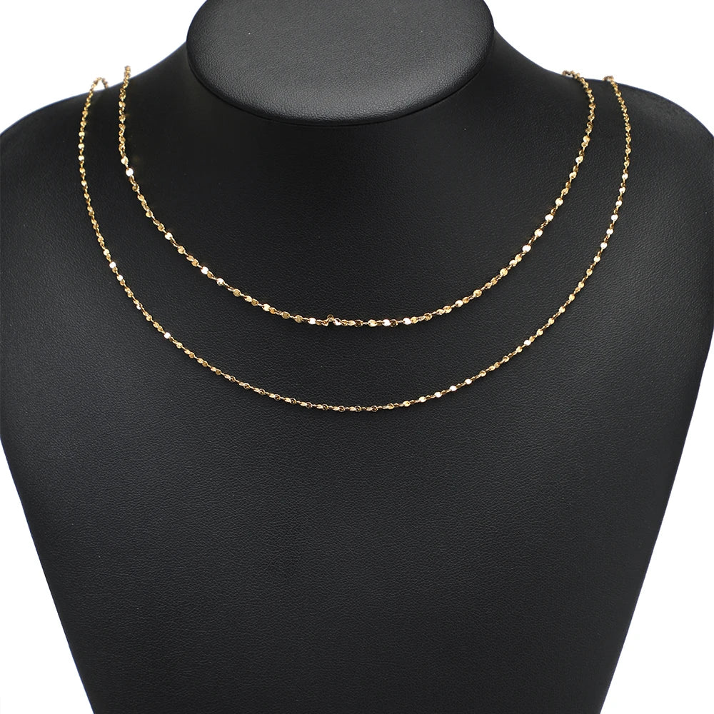 Gold plated flat flower chain necklace, double-strand on black mannequin bust