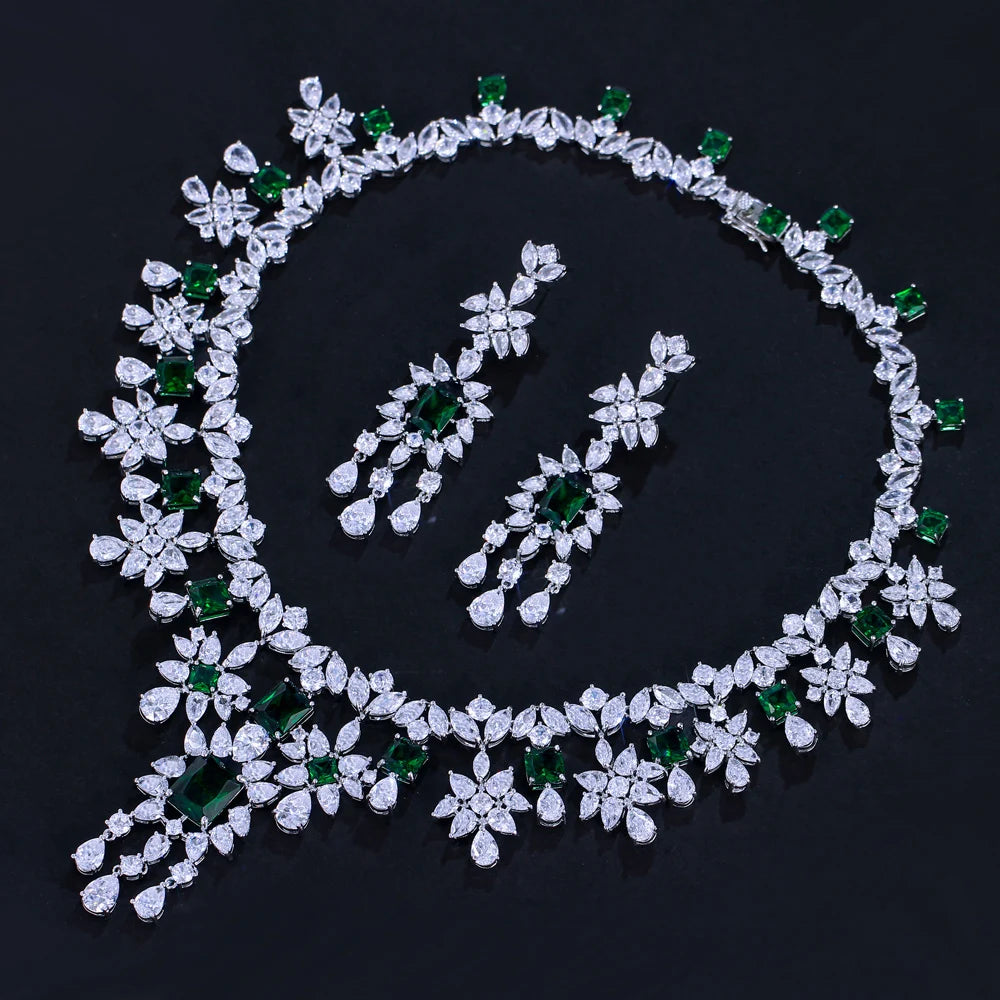 Cubic zirconia floral necklace and matching drop earrings arranged as a set