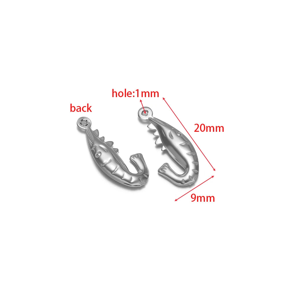 Silver fish-shaped stainless steel hollow charm with round loop, for DIY ocean jewelry