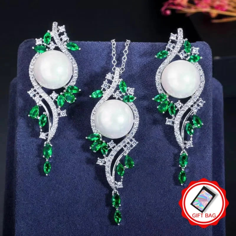 White imitation pearl necklace and drop earrings with green zirconia leaf accents