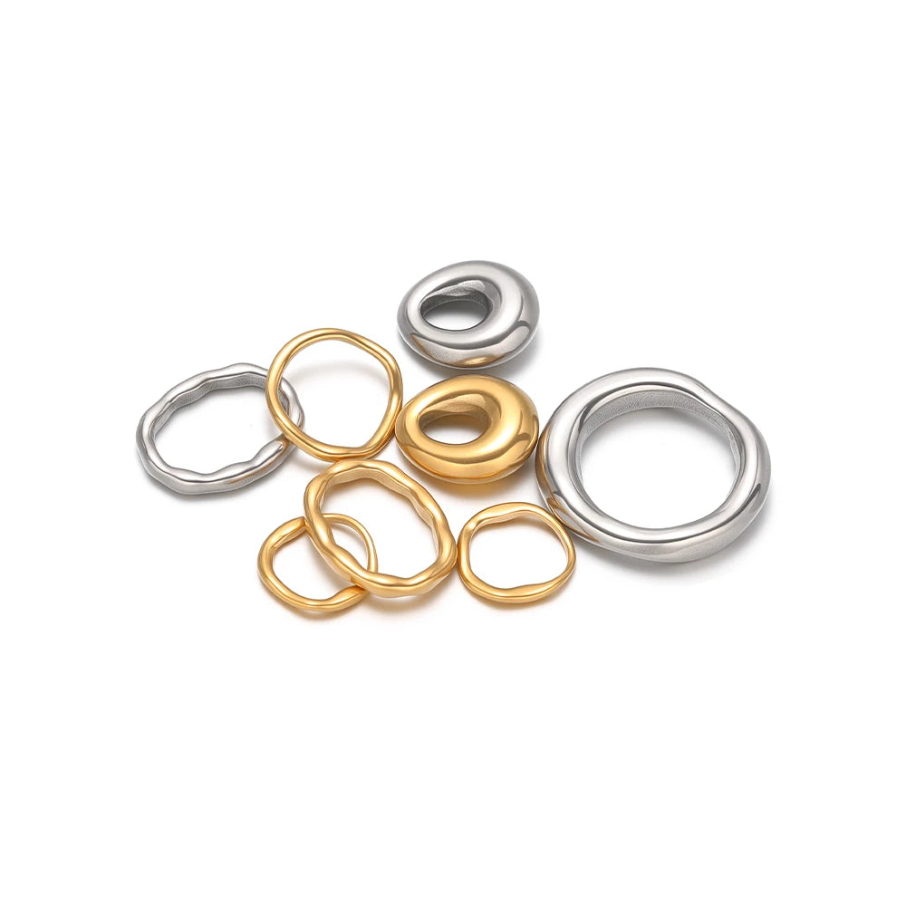 Set of five metal open ring and round charm connectors in gold and silver tones
