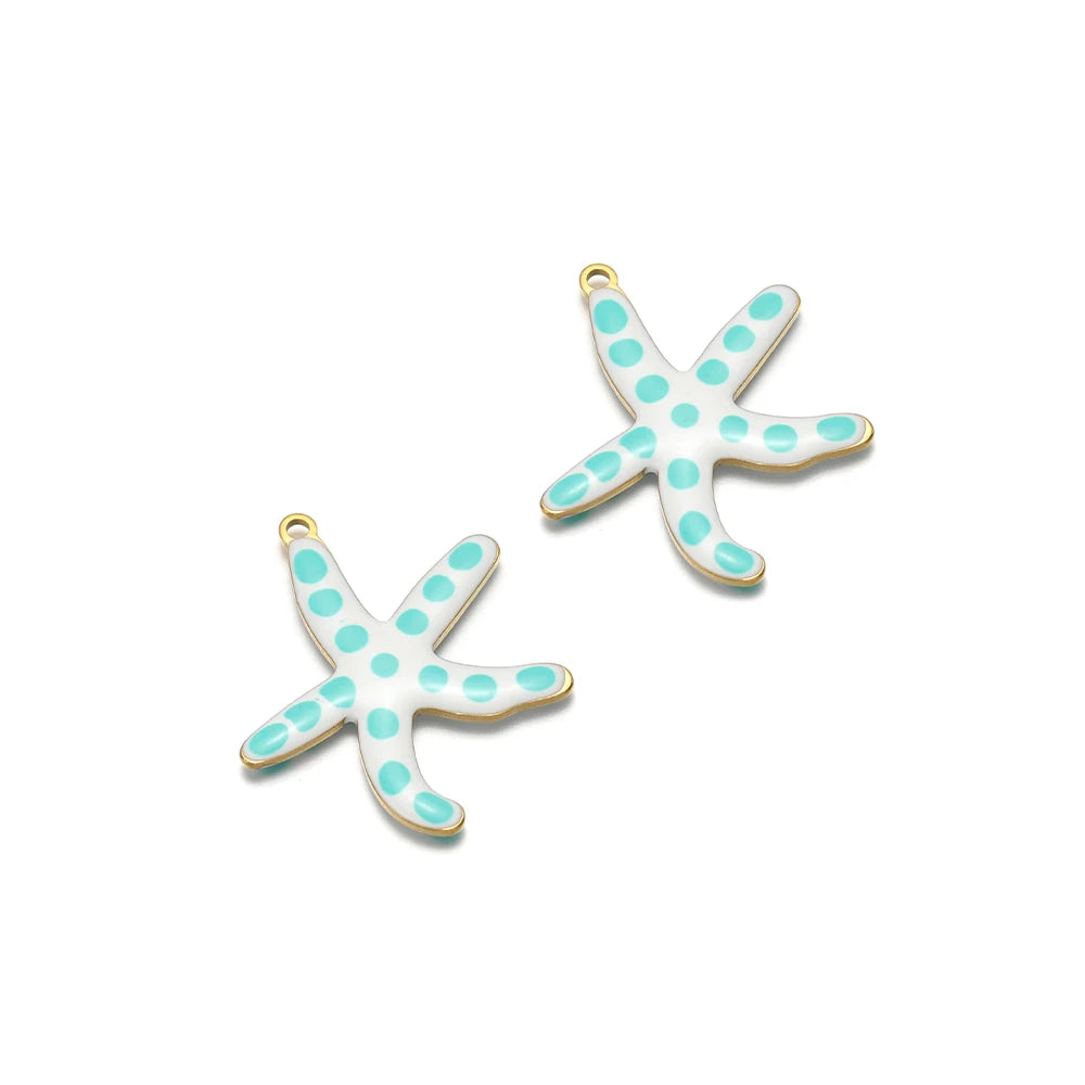 Two mint teal enamel starfish charms with gold-tone loops and white dot accents