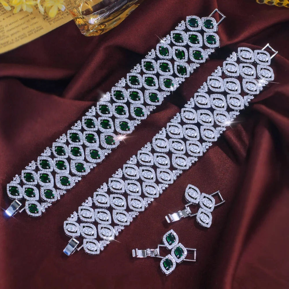 Wide multi-row zirconia bracelet with green and clear stones, shown with matching clasp pieces