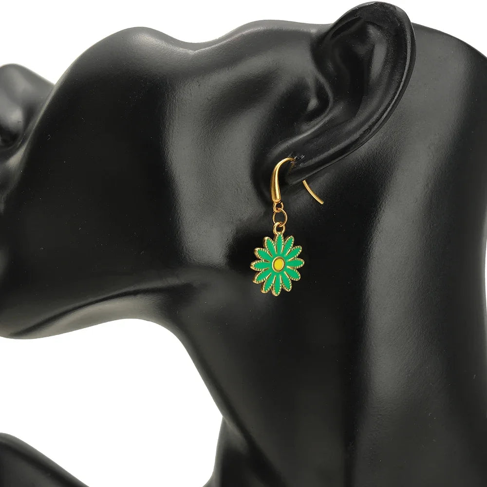 Gold-tone ear wire hook with small enamel flower charm in green and yellow
