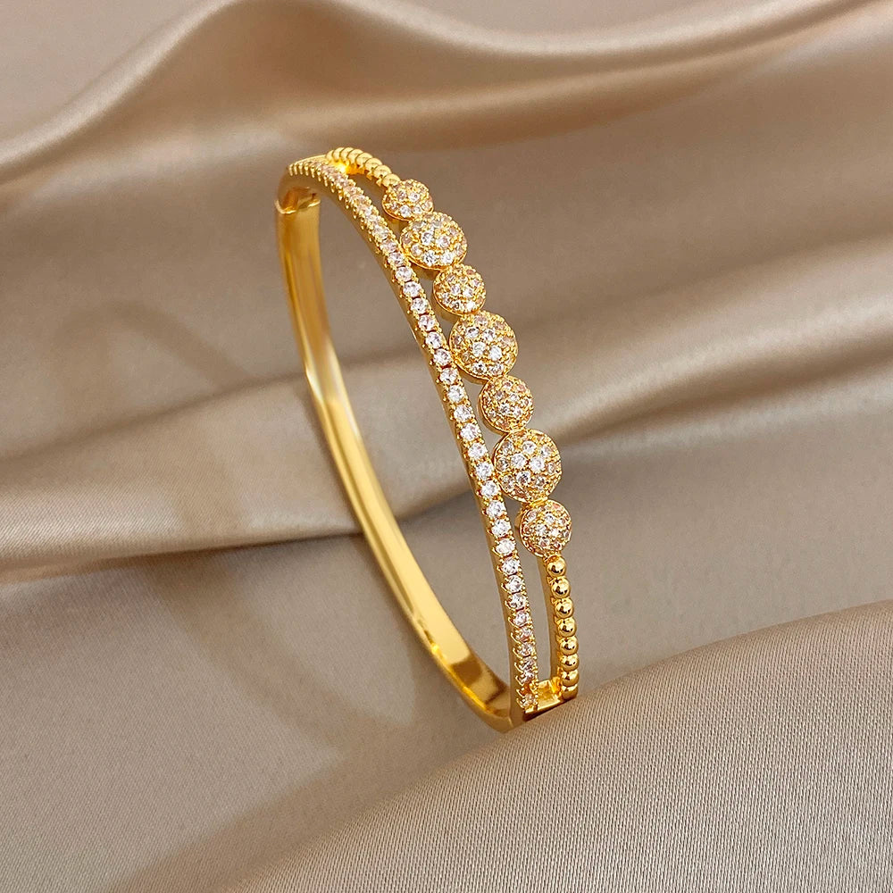 Gold-plated zircon bangle bracelet with round stone accents