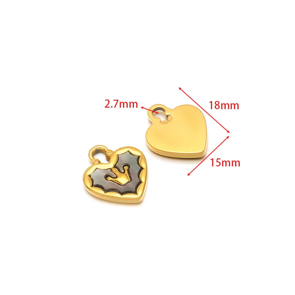 Gold-tone heart shell charm pendants with cutout star and shell details.