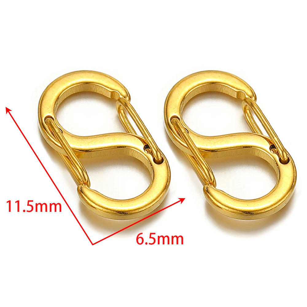 Gold letter S spring lobster clasps, close-up with two clasp units