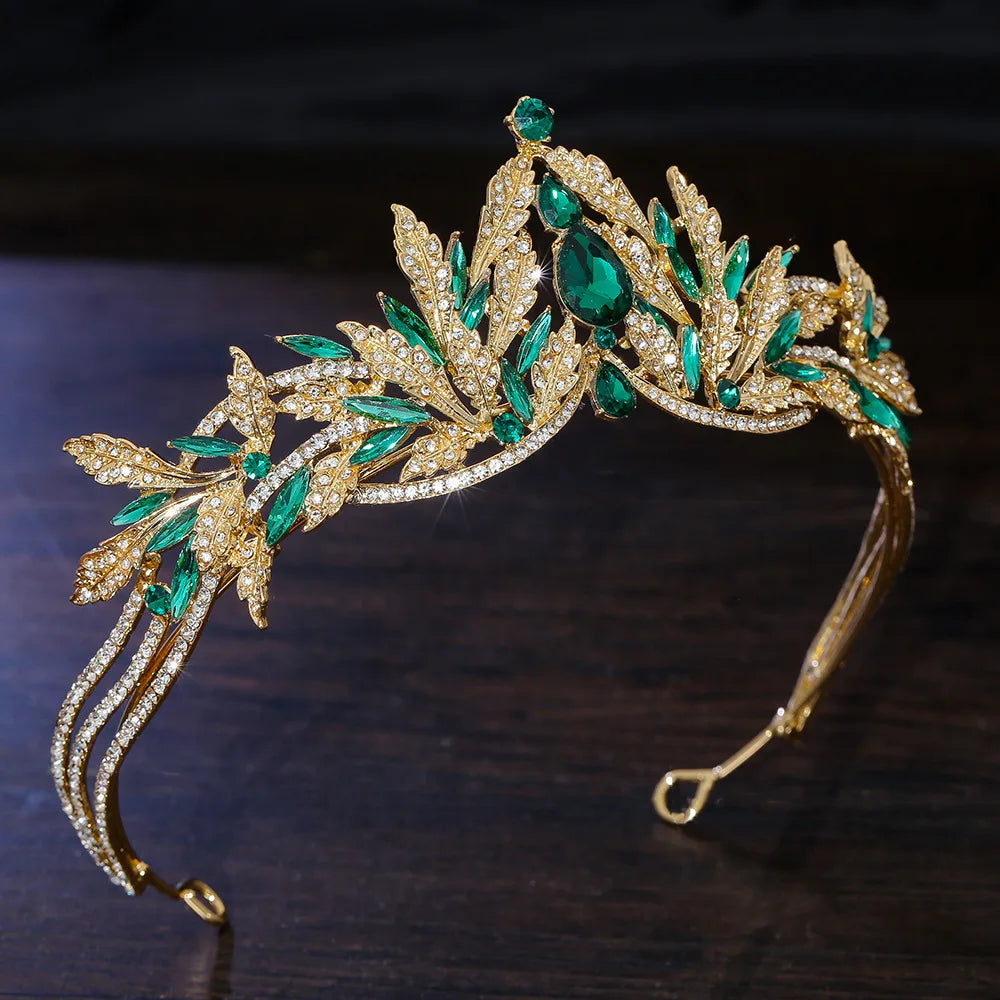Gold rhinestone tiara headband with green emerald crystals and clear leaf settings