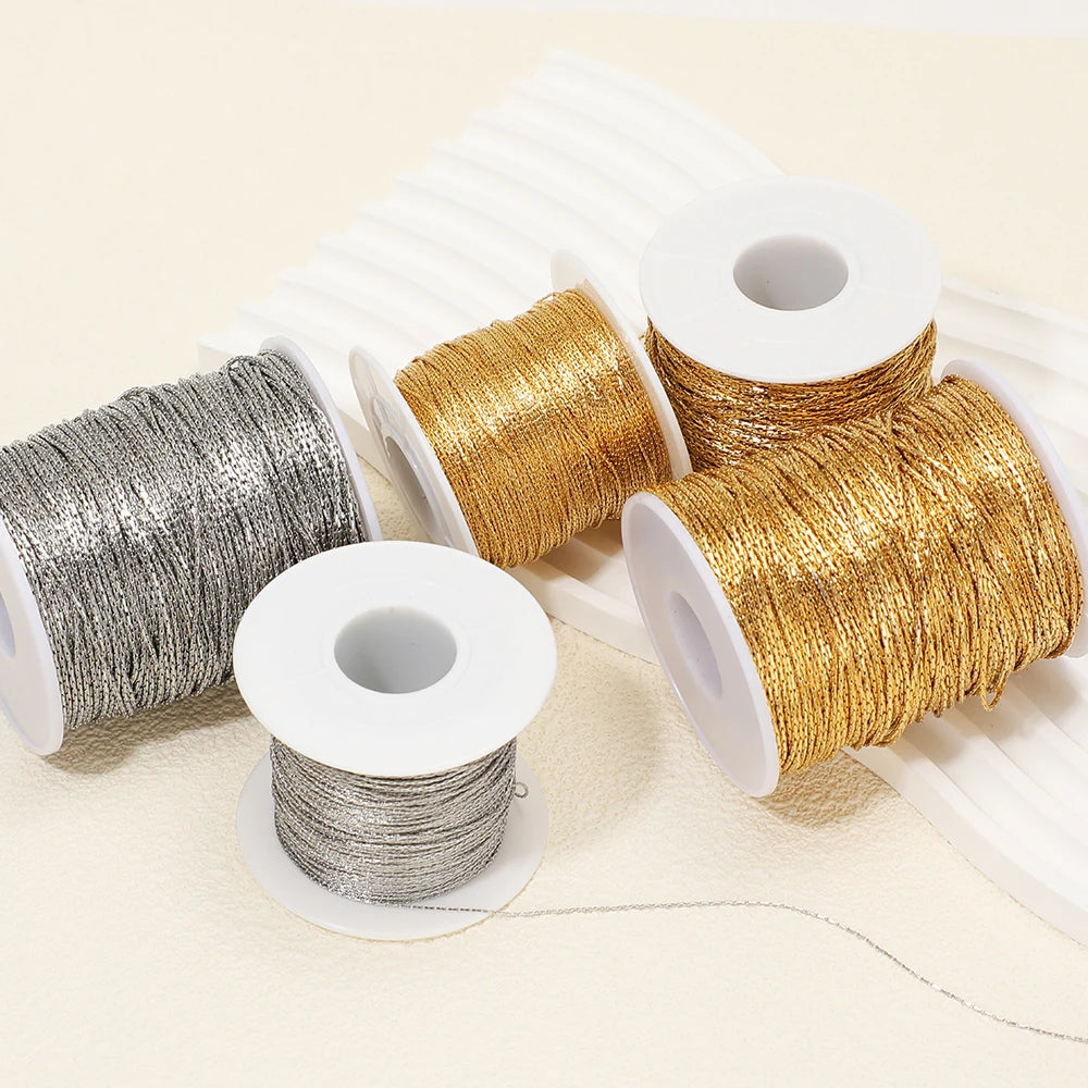 Gold and silver thin wire chain spools with loose strands for DIY jewelry