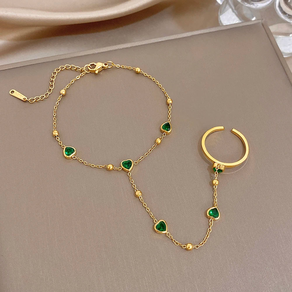Gold-plated chain bracelet with green heart beads and matching hoop-like ring