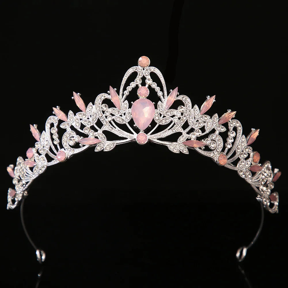 Jeweled bridal tiara crown with pink oval center gemstone and pink floral crystal leaves