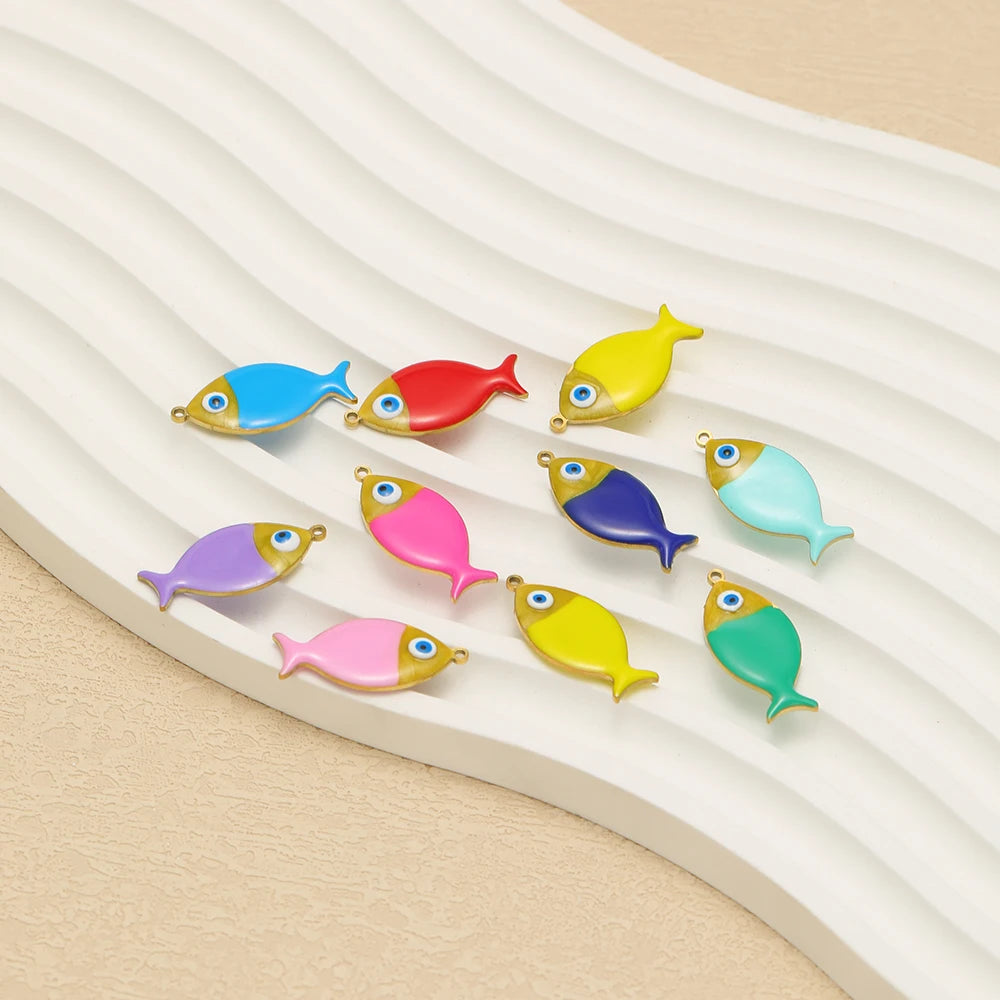 Assorted enamel fish charms in multiple colors with gold-tone loops